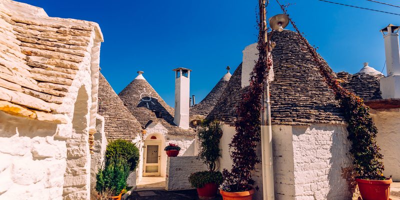 Beautiful single-storey houses of rounded construction called trulli, typical of the area of Alberobello in Italy.