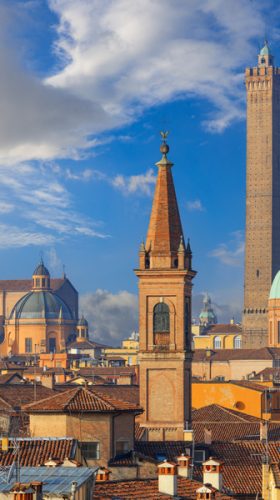 Bologna, Italy rooftop skyline and famous historic towers in the daytime.