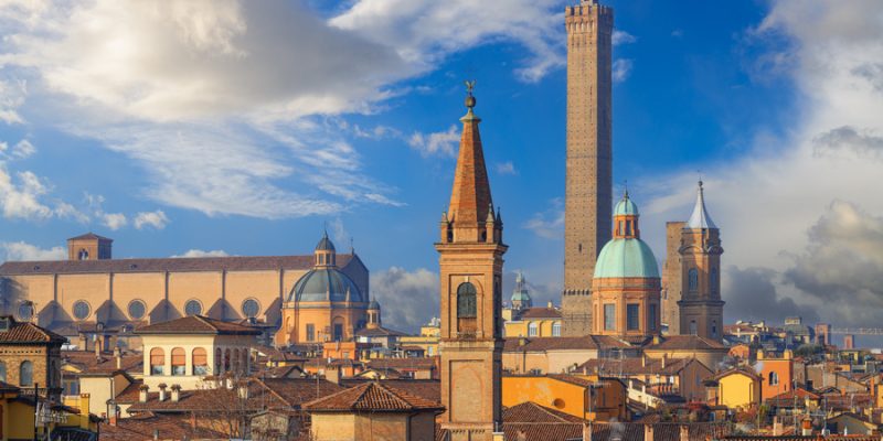 Bologna, Italy rooftop skyline and famous historic towers in the daytime.